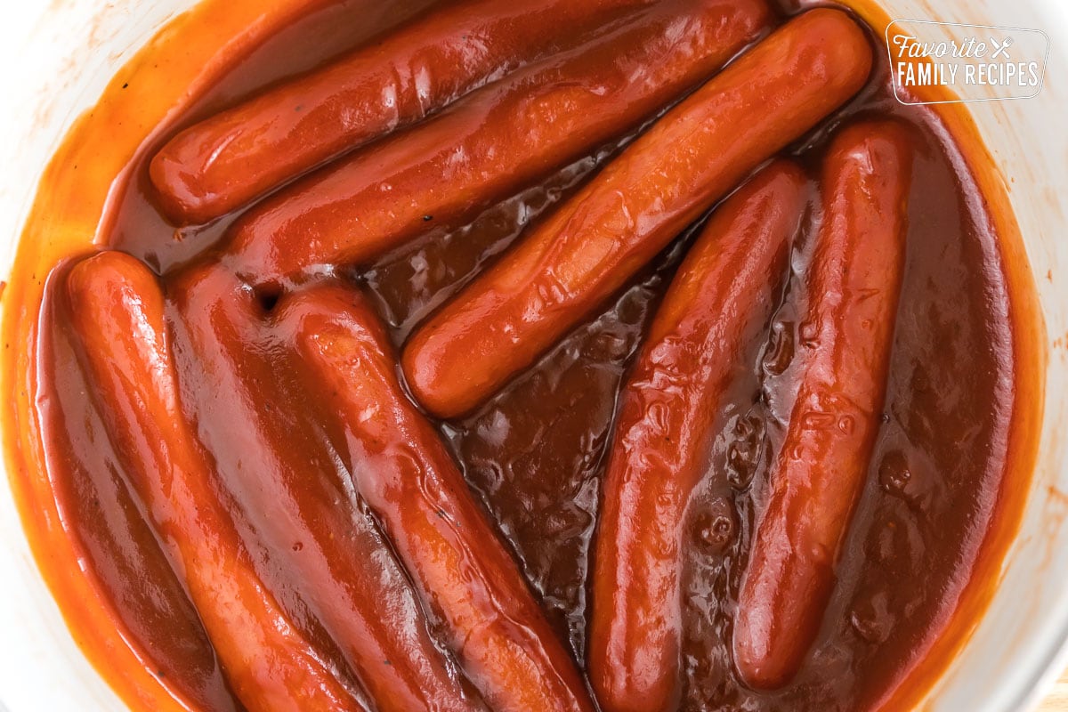 Hot dogs in a pot cooked in bbq sauce