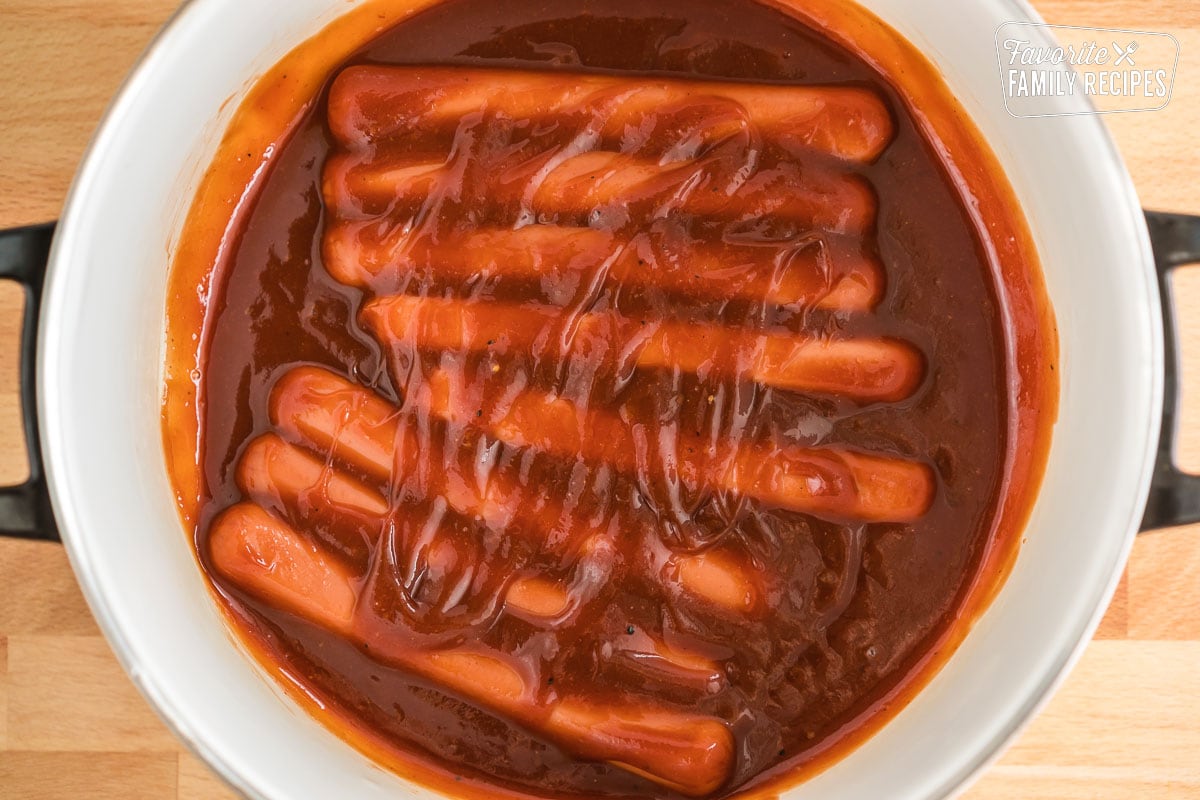 hot dogs in bbq sauce in a pot before being heated up
