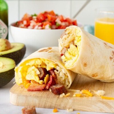 A breakfast burrito filled with eggs, bacon, and sausage