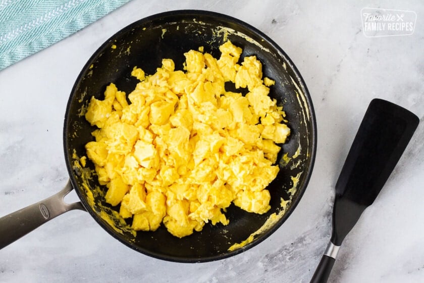 Scrambled eggs in a frying pan