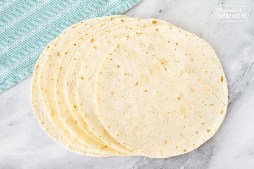 Flour tortillas stacked on a counter top