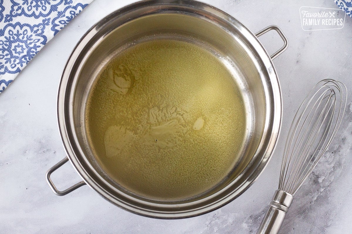 Pan of butter melting for cream sauce for Baked Cod.