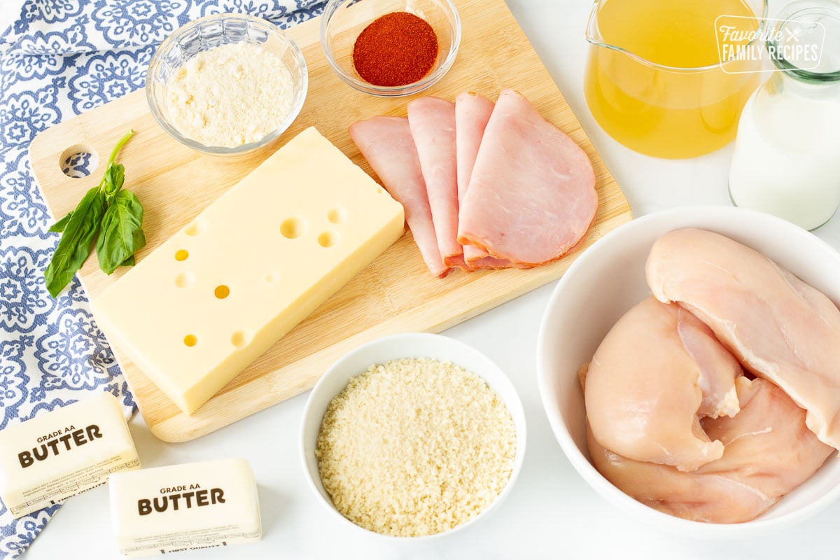 Ingredients for Chicken Cordon Bleu including chicken, Swiss cheese, Black Forest ham, chicken broth, cream, paprika, parmesan cheese, panko and butter.