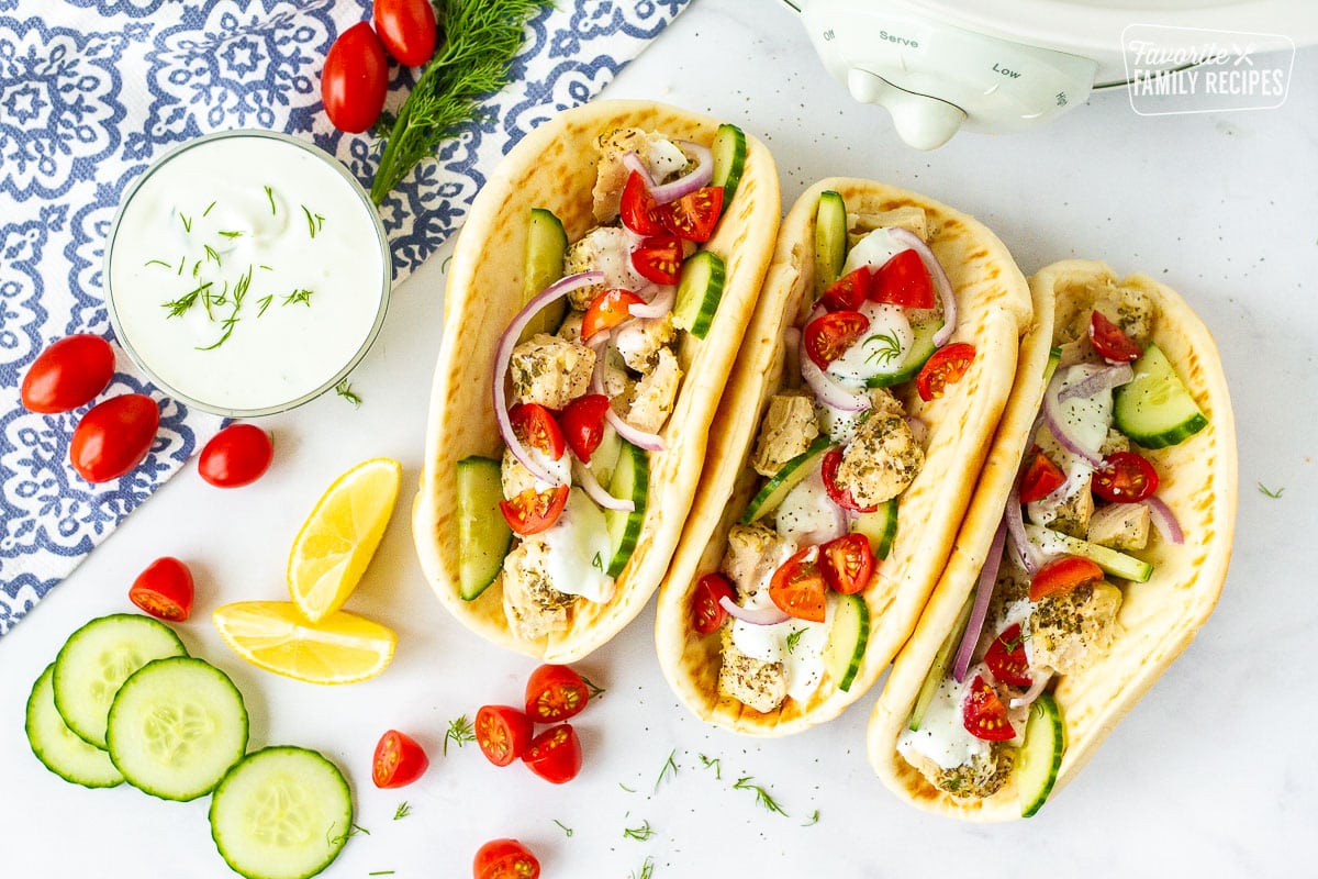 Chicken Gyros with Pita bread topped with chicken, tomatoes, cucumbers, red onions and dill.