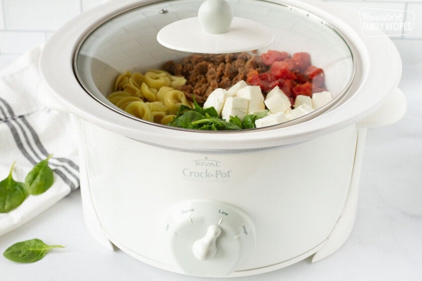 Crockpot on low cooking Creamy Tortellini Soup.