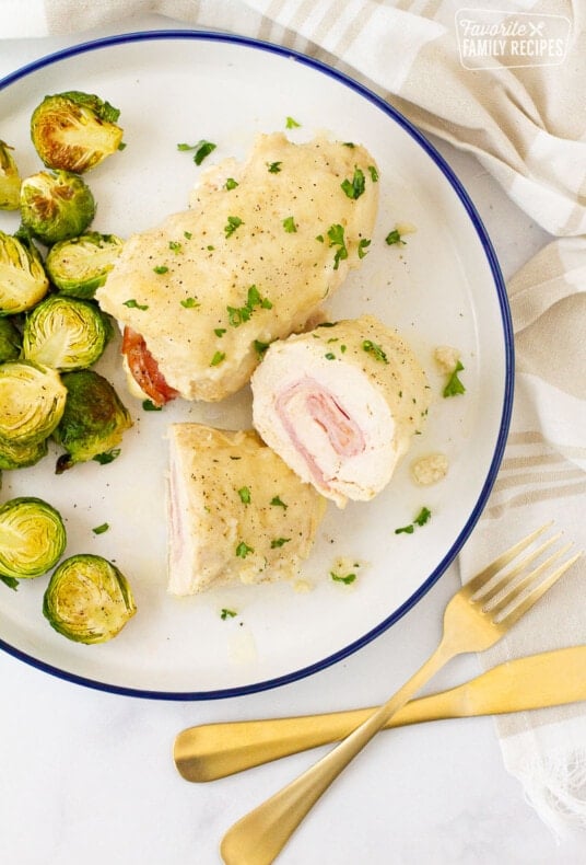 Instant Pot Chicken Cordon Bleu cut in half next to a whole Chicken Cordon Bleu.