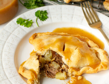 Cut open Donovan's Irish Pastie on a plate with gravy.