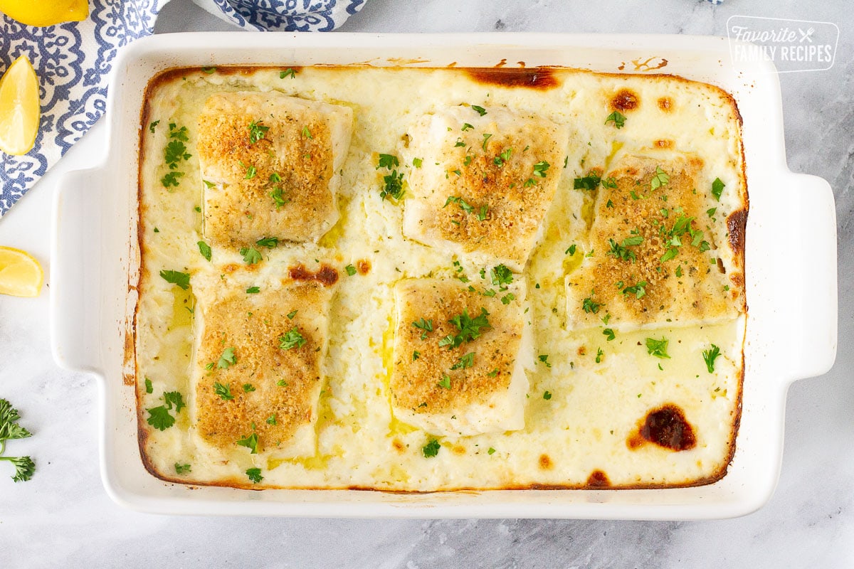 Baking dish with five fillets of Baked Cod in Cream Sauce.