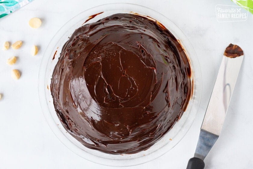 Chocolate fudge covering Duke's Hula Pie ice cream. Spatula on the side.