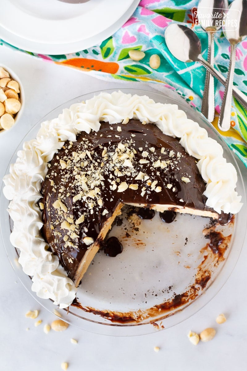 Top view of Duke's Hula Pie missing slices. Plates and spoons on the side.