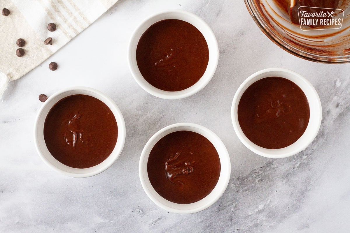 Four ramekins with Carnival Cruise Melting Chocolate Cake batter.