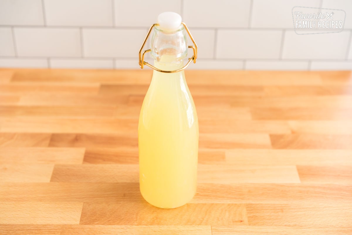 A glass bottle of ginger syrup