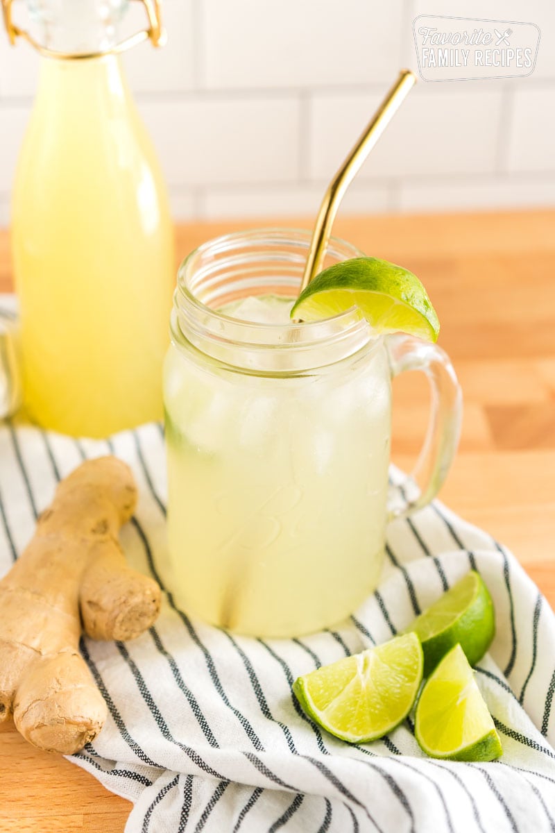 A mug of homemade ginger ale with a lime slice