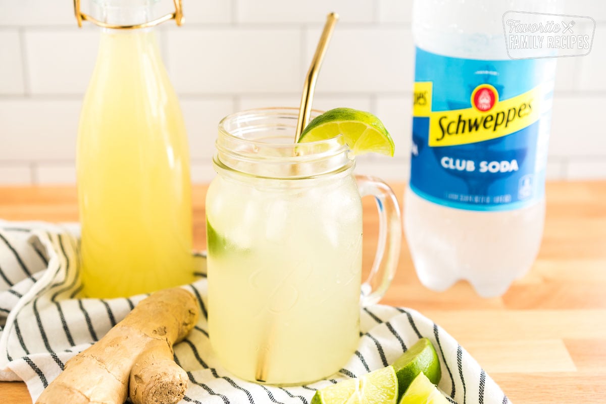 A mug of homemade ginger ale with a lime slice