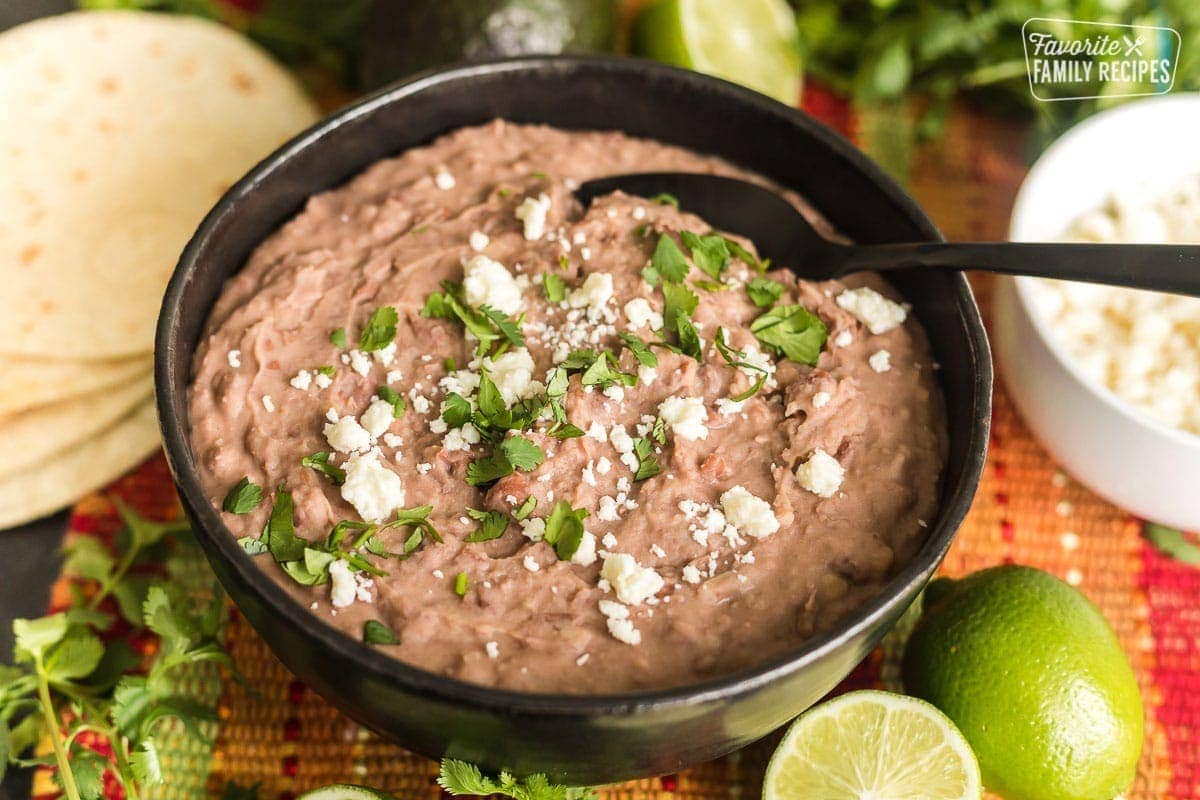 A ceramic bowl with homemade refried beans.