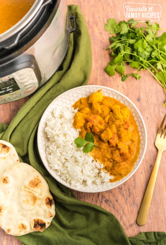 Instant pot chicken tikka masala with the white bowl.