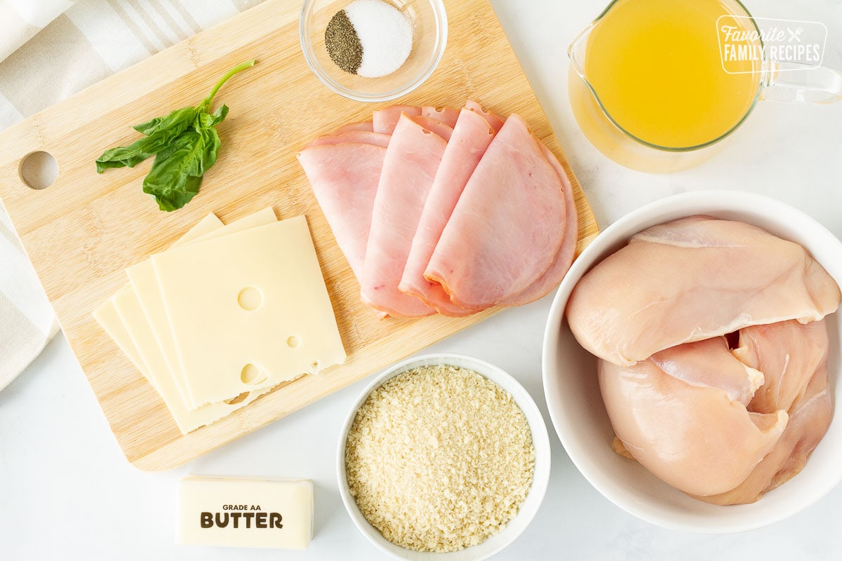 Ingredients to cook Instant Pot Chicken Cordon Bleu including chicken, pano, Swiss cheese, butter, chicken broth, salt, pepper and Black Forest ham.
