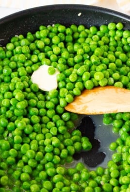 Cooking frozen peas the right way in a skillet with butter and garlic.