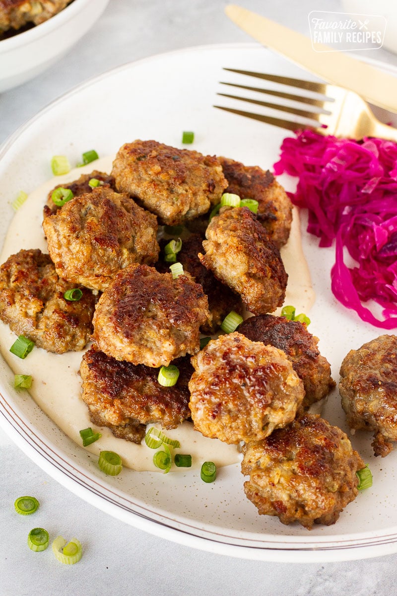 Plate of Frikadeller (Danish Meatballs) with red cabbage.