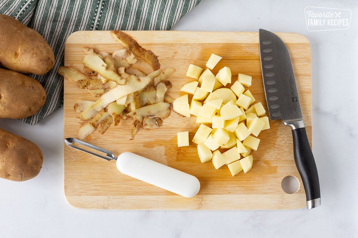 Cutting board with peeled and cubed potatoes for Donovan's Irish Pasties.