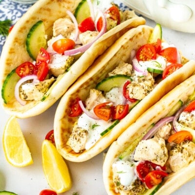 Chicken Gyro with tzatziki sauce, tomatoes, cucumbers, red onion and dill.