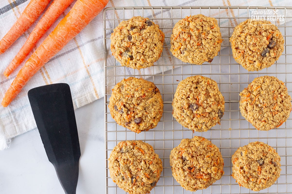 Baked Carrot Cake Cookies on a cooling rack. Spatula on the side.