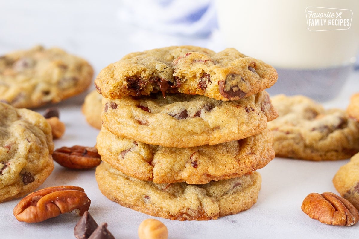 Close up of a bite missing from a Turtle Cookie with a melted chocolate chip.