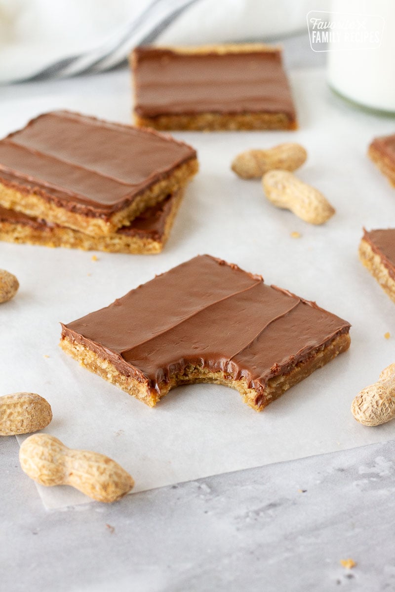Bite out of a Peanut Butter Bar on parchment paper.