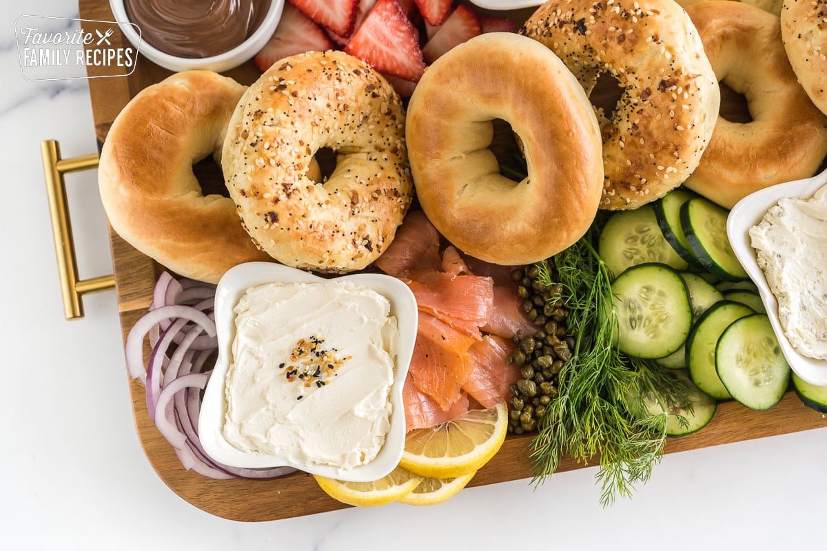 brunch charcuterie board full of bagels, spreads, and toppings