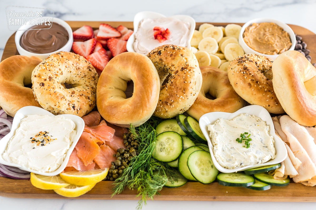 brunch charcuterie board full of bagels, spreads, and toppings