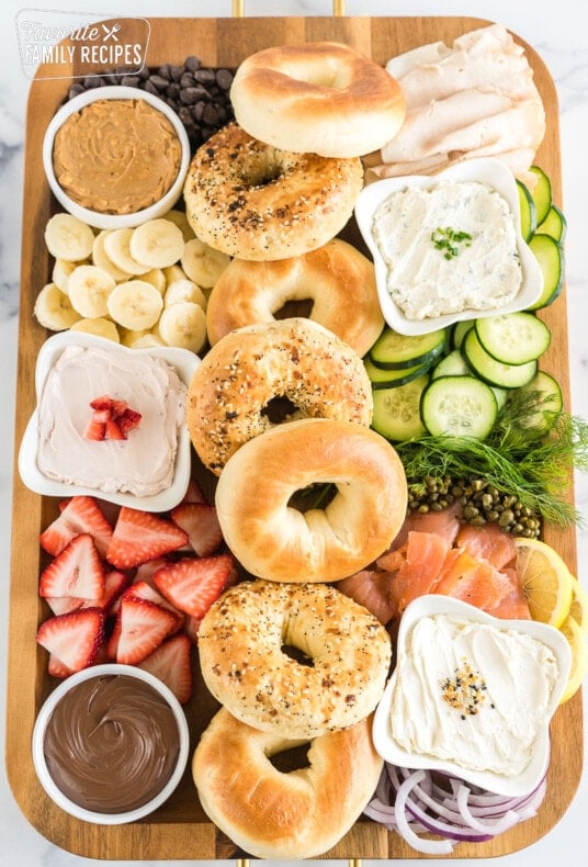 brunch charcuterie board full of bagels, spreads, and toppings