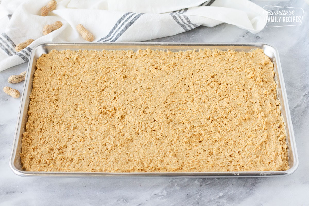 Cookie sheet of spread out Peanut Butter Bar dough.