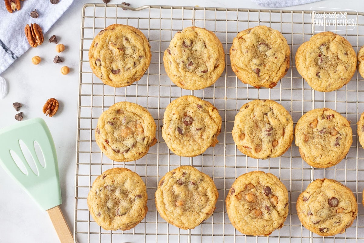 Baked Turtle Cookies on a wire cooling rack.