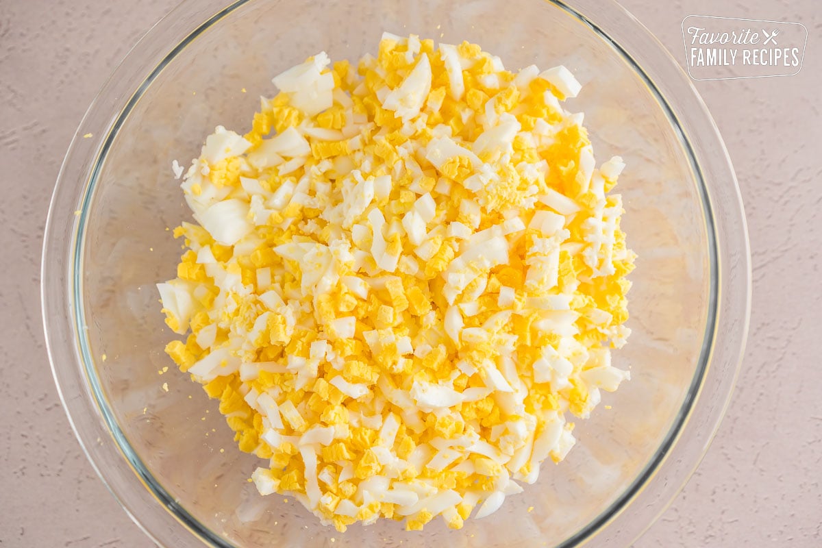 Hard boiled eggs diced in a bowl