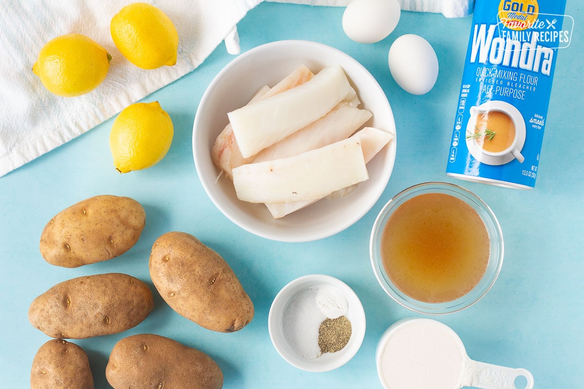 Ingredients for Fish and Chips including cod, Wondra, eggs, lemon, potatoes, beef broth, flour, salt, pepper and baking powder.