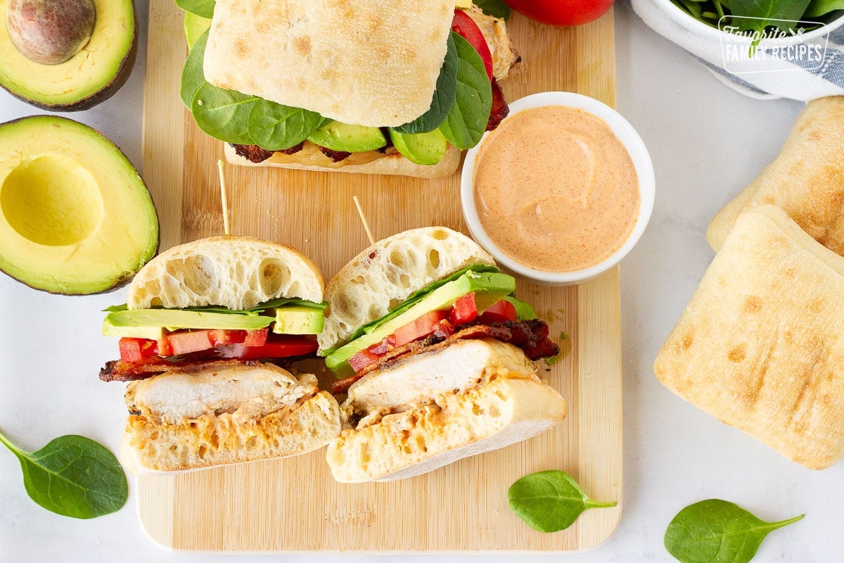 Grilled Chicken Sandwich cut in half next to a whole Sandwich.