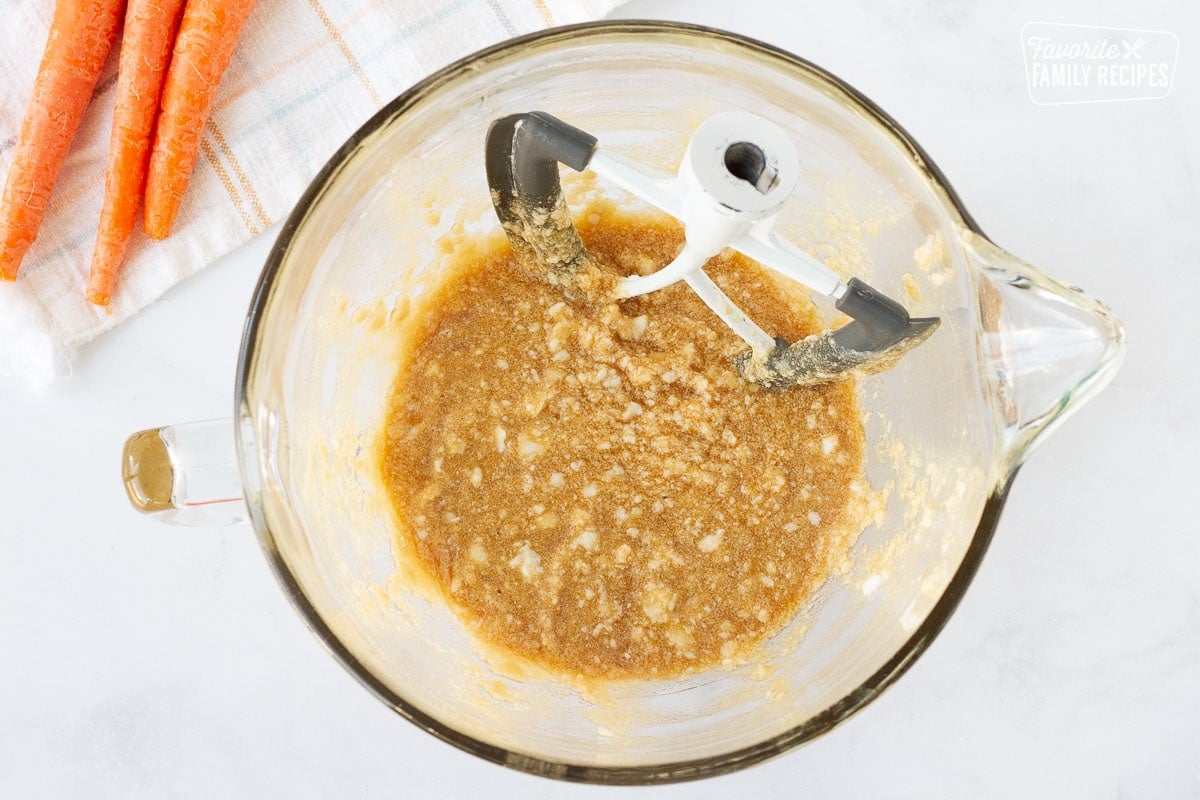 Mixing bowl with blended shortening, sugar and egg for Carrot Cake Cookies.