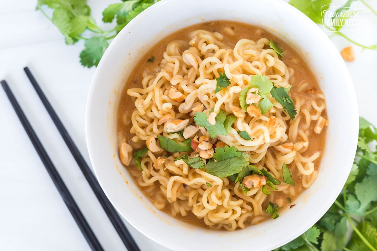 A close up top view of a bowl of peanut butter ramen.