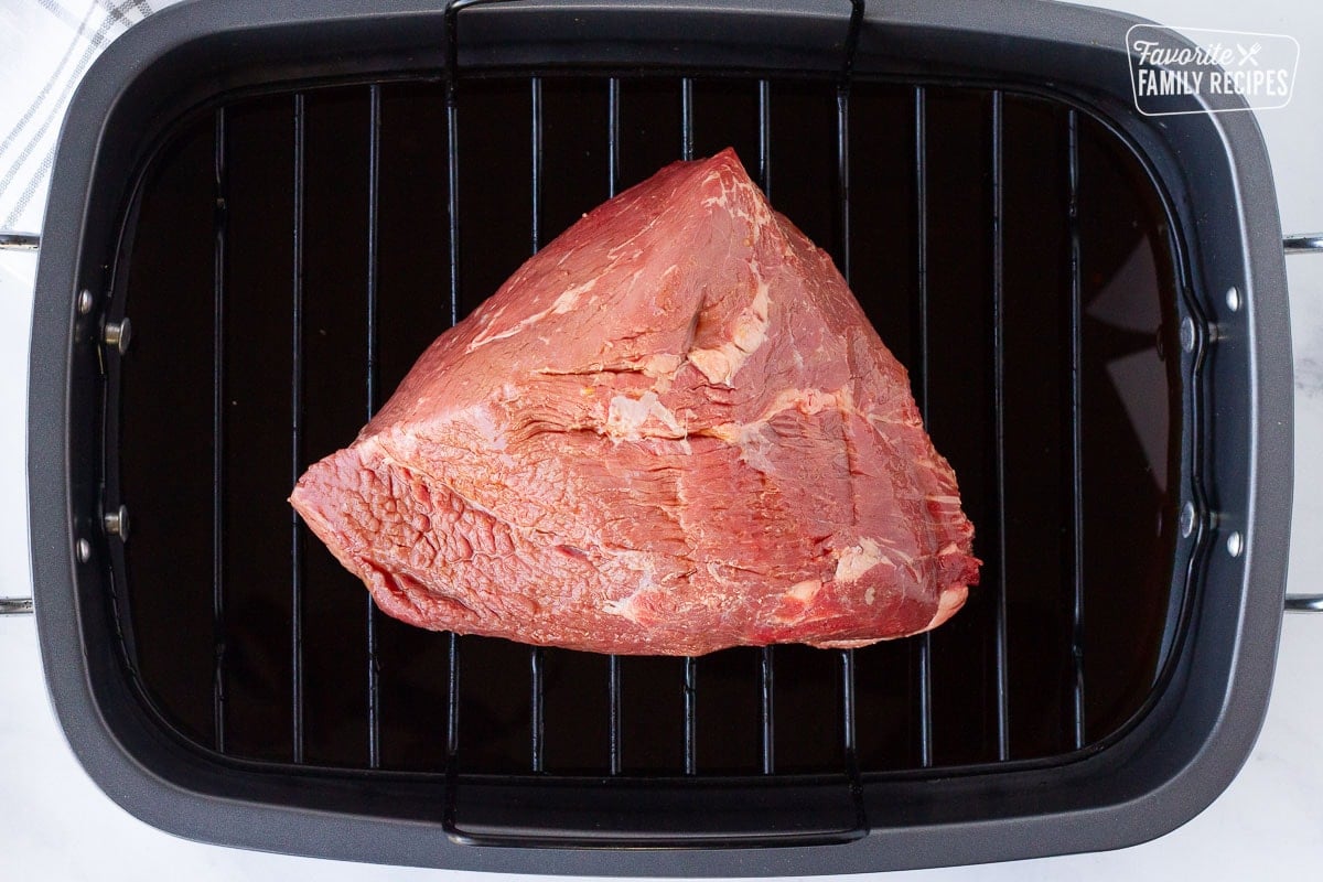 Roasting pan with a Roast and Beef Consommé for Italian Beef Sandwiches.