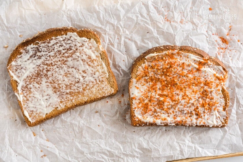 Toast with mayo on it and seasoning.