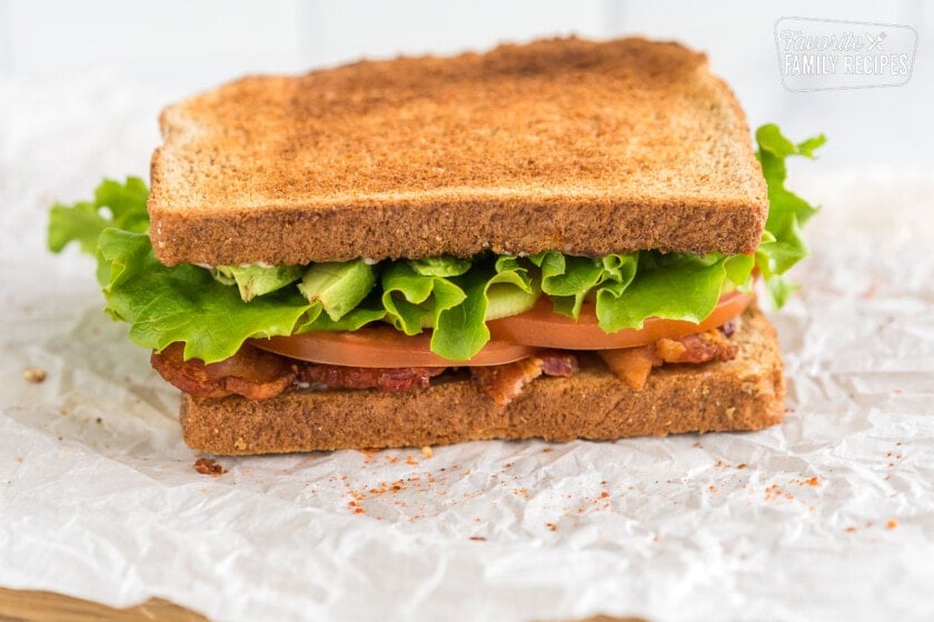 BLT on crinkled parchment paper.