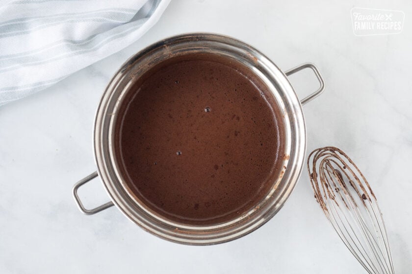 Small sauce pan of chocolate mix for Costco Peanut Butter Chocolate Cream Pie.