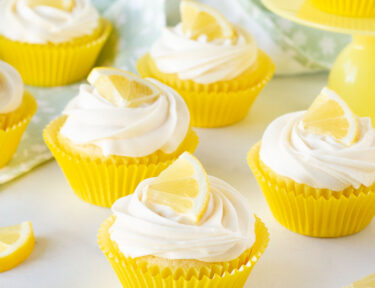 Lemon Cupcakes decorated with fresh lemon slices.