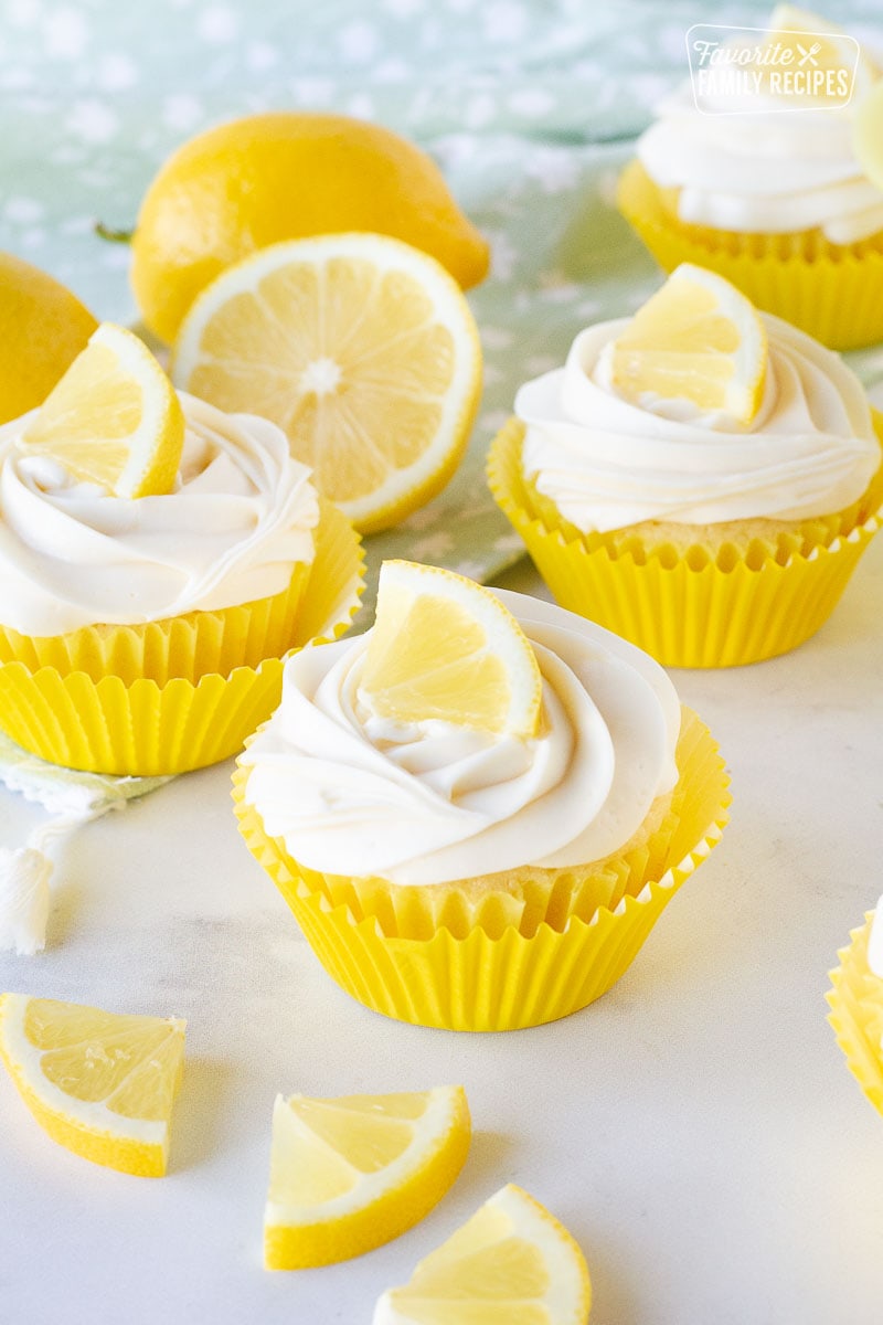 Frosted Lemon Cupcakes with a lemon slice on top.