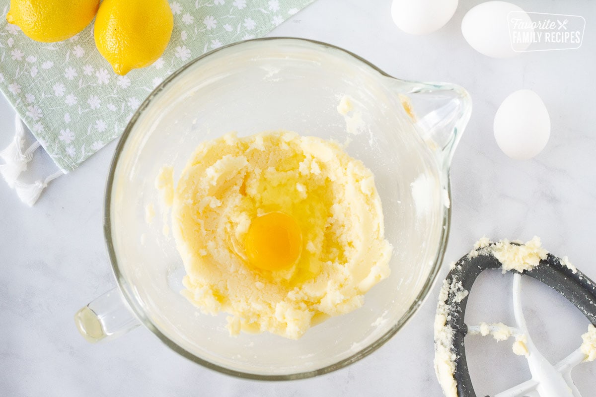 Mixing bowl with creamed sugars and eggs for Lemon Cupcakes.
