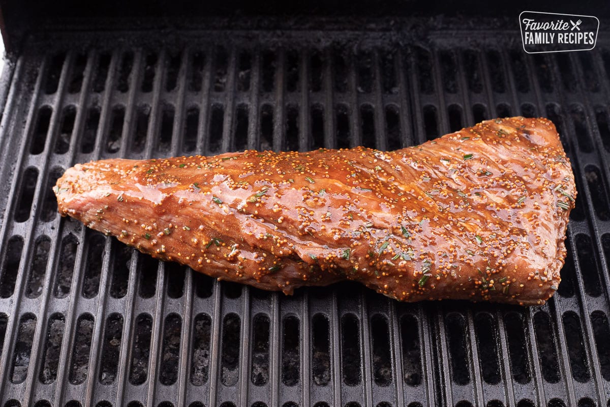 Grilling a marinaded Tri Tip Roast on a barbecue grill.