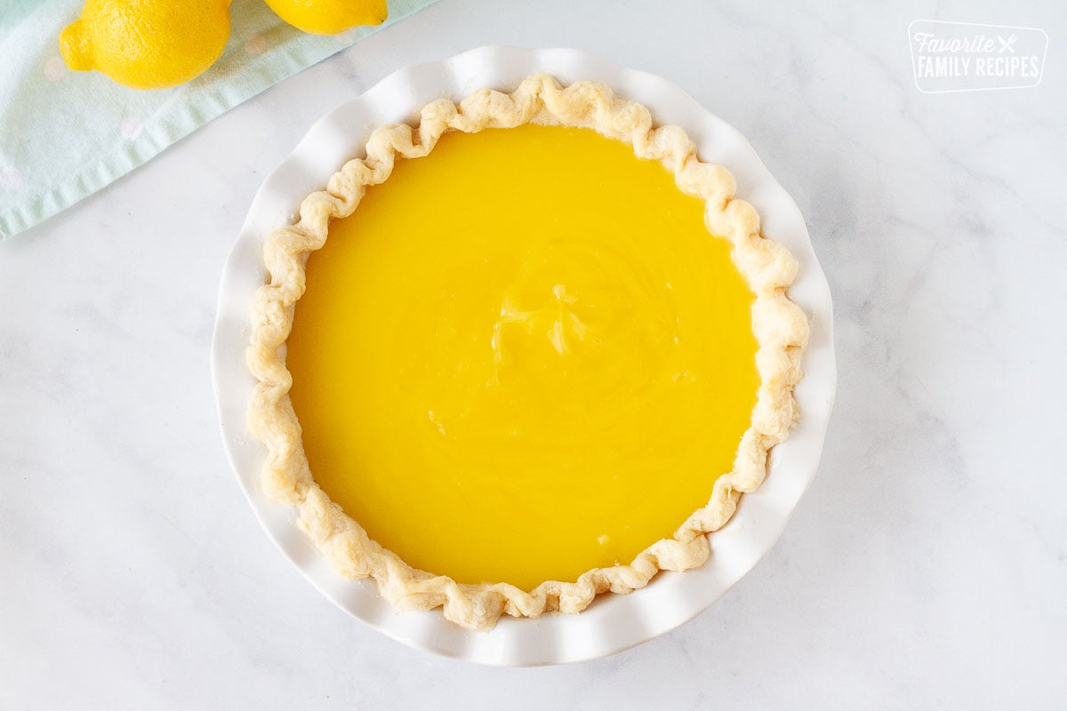 Pie crust filled with Lemon custard for Lemon Meringue Pie.