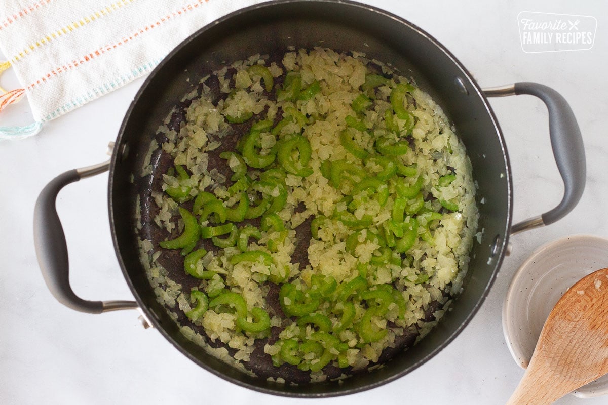 Pot of butter, onions and celery for Creamy Vegetable Soup.