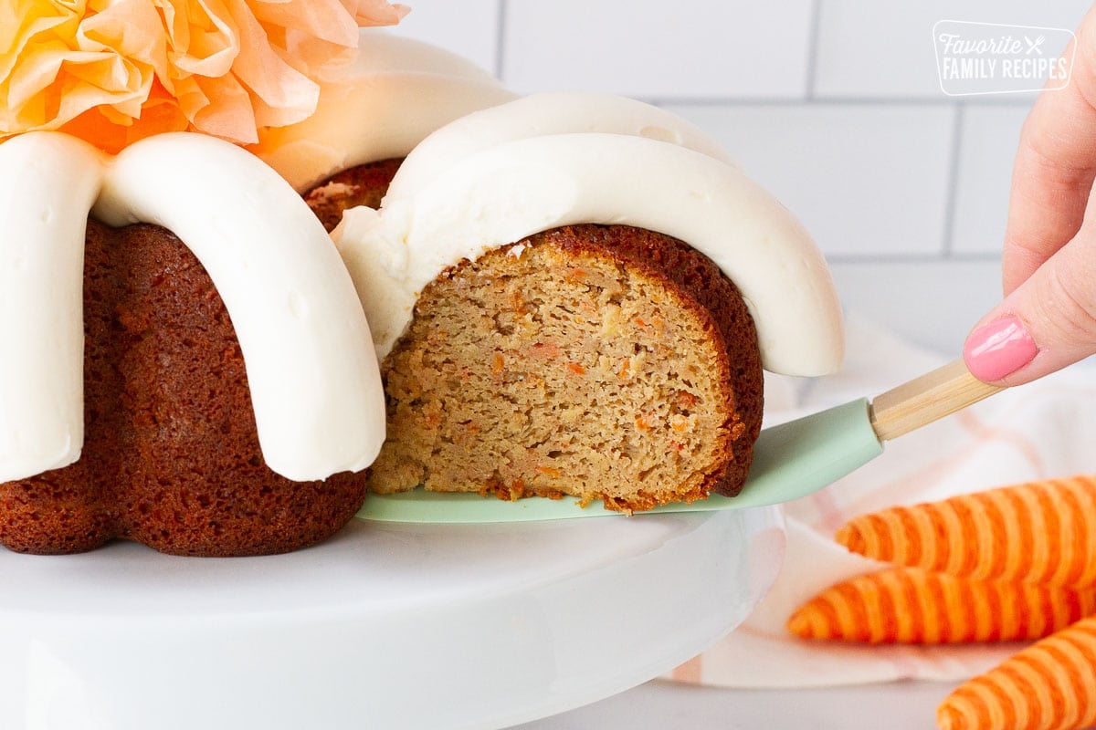 Spatula pulling out a slice of Carrot Bundt Cake.