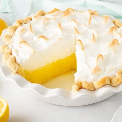 Lemon Meringue Pie with a cut out slice.
